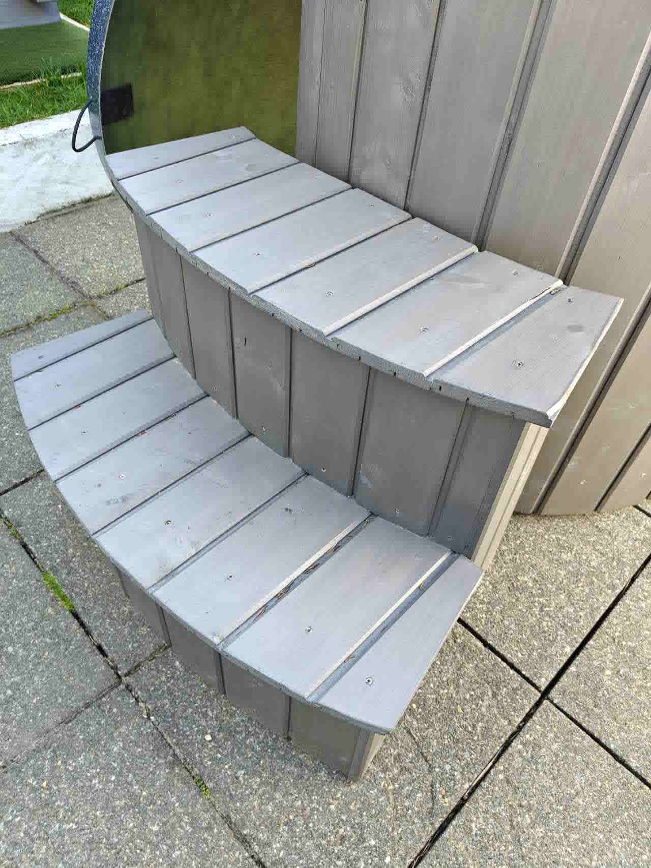 Detail view of the heavy-duty matching spruce wood steps designed for The Labrum wellness tub.